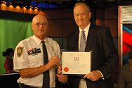 Bill receives an award from Dennis Wise, the National President of the American Federation of Police and Concerned Citizens.