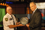 Bill receives an award from Dennis Wise, the National President of the American Federation of Police and Concerned Citizens.